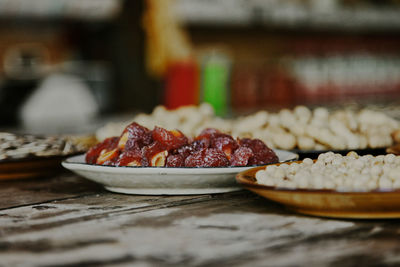 Close-up of fruits in plate on table