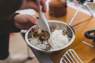 High angle view of person preparing food in bowl