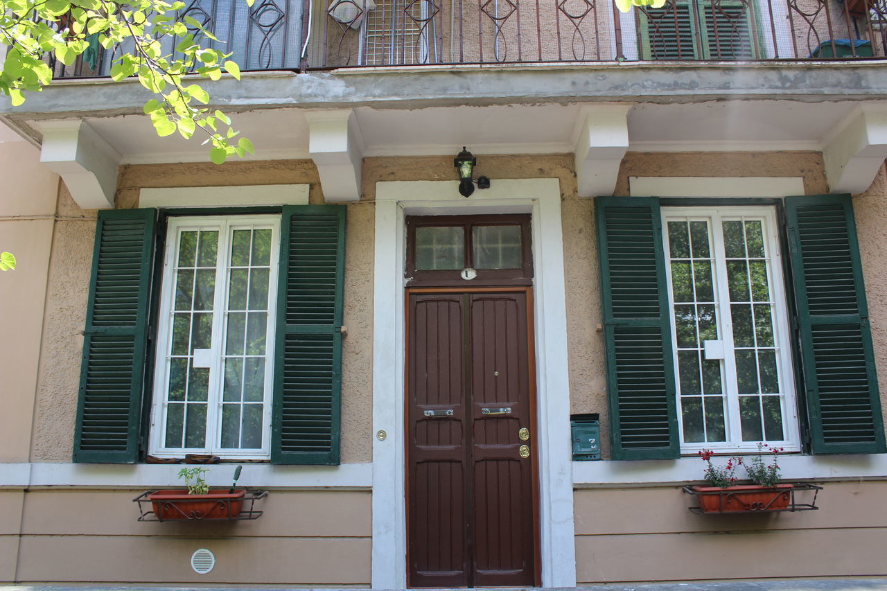 LOW ANGLE VIEW OF BUILDING WITH WINDOWS