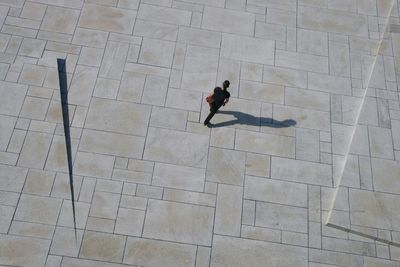 High angle view of man walking on floor