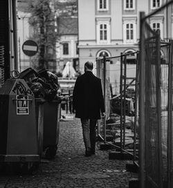 Rear view of man standing on street