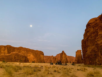 Rock formations on landscape against sky