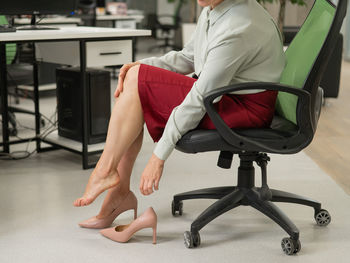 Low section of woman exercising in gym