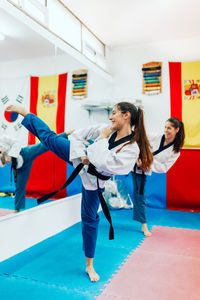 Young women practicing martial arts