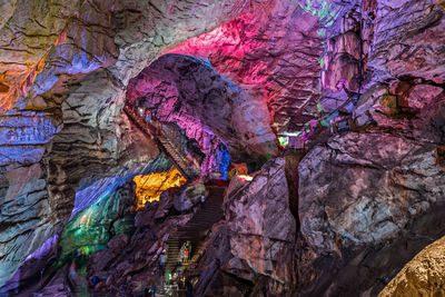 Low angle view of multi colored rock formation in cave