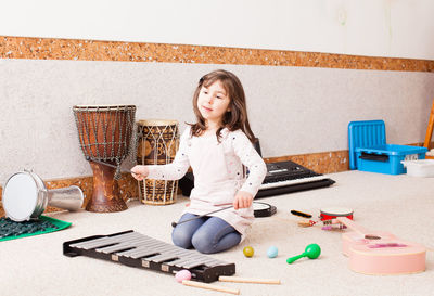 Girl playing with toy at home