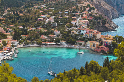 High angle view of townscape by sea