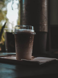 Close-up of coffee cup on table