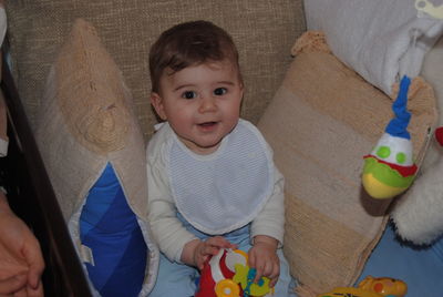 Portrait of cute baby toy at home