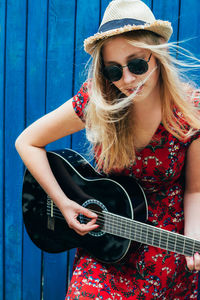 Portrait of a young woman wearing sunglasses