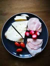 High angle view of fruits in plate on table