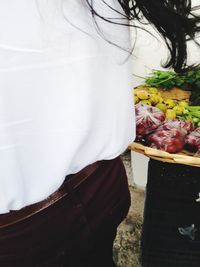 Close-up of man standing against white background