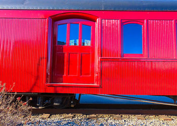 Train passing through window of building