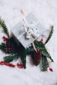 High angle view of christmas present on snow