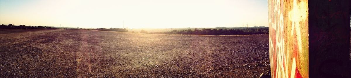 Scenic view of landscape against sky at sunset