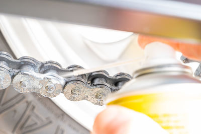 Motorcycle drive chain, and lubricant spray.