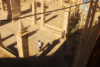 High angle view of people walking on road