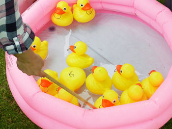 High angle view of yellow toys floating on water