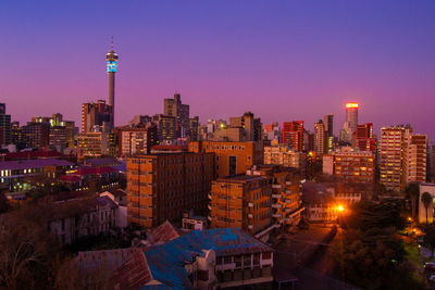 Illuminated buildings in city at night