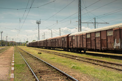 Train on railroad track against sky