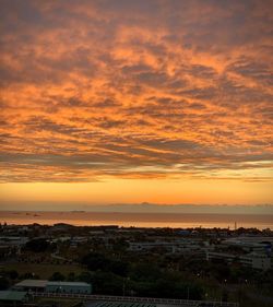 Scenic view of sea against orange sky