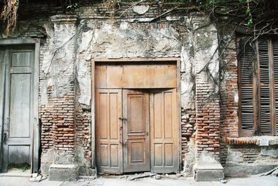 Closed door of abandoned house