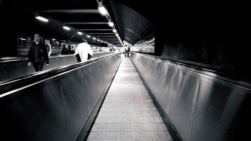 Blurred motion of people walking in tunnel
