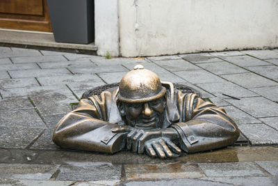 Buddha statue on footpath