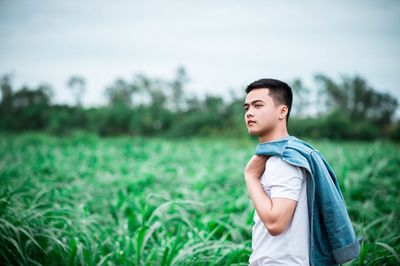 Boy standing on field