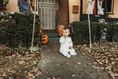 Adorable toddler boy dressed up as mummy on halloween trick-or-treat