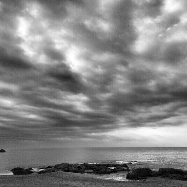 sea, sky, horizon over water, cloud - sky, cloudy, water, scenics, tranquil scene, beach, tranquility, beauty in nature, overcast, shore, weather, nature, storm cloud, cloud, idyllic, rock - object, dramatic sky