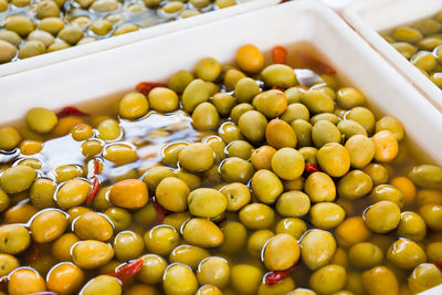 Full frame shot of pickled olives for sale at market stall