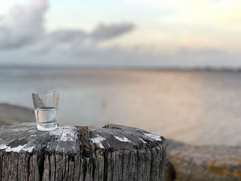Close-up of wooden post in sea
