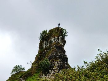 Low angle view of rock against sky