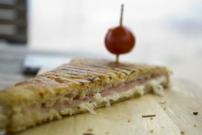 Ham and cheese toast on a wooden board