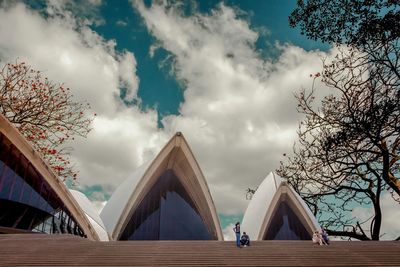 Low angle view of built structure against cloudy sky
