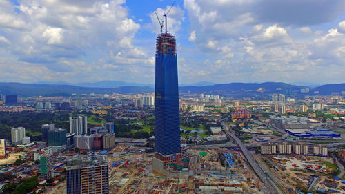 High angle view of buildings in city against sky