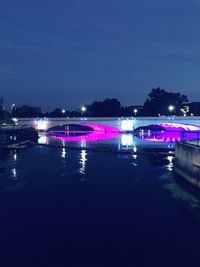 Reflection of illuminated buildings in water