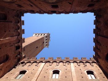 Low angle view of old building/tuscany/italy/art/architecture/square/tower