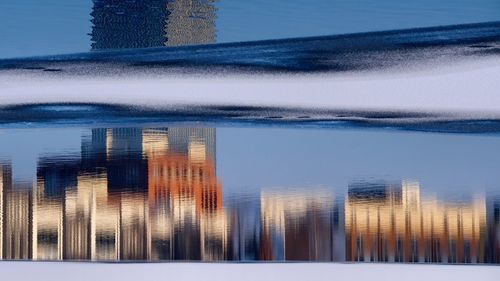 Close-up of reflection of buildings in water