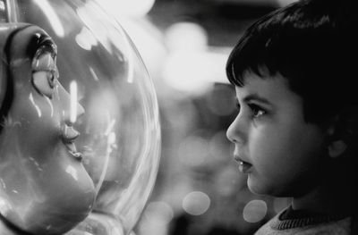 Close-up portrait of boy looking away