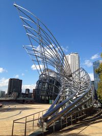 View of buildings against blue sky