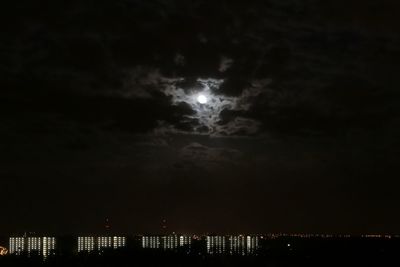 Scenic view of lake against sky at night