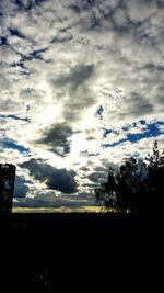 Low angle view of silhouette landscape against sky during sunset