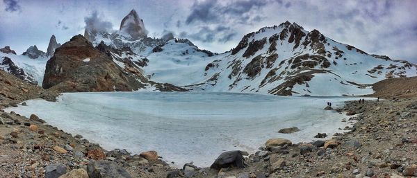 Scenic view of mountains against cloudy sky