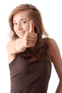 Portrait of a smiling young woman over white background