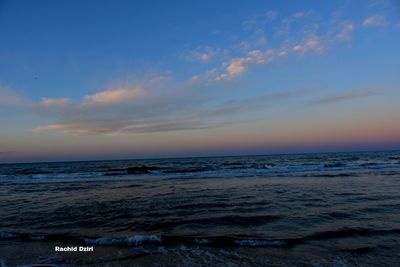 Scenic view of sea against sky at sunset