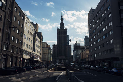 View of buildings against cloudy sky