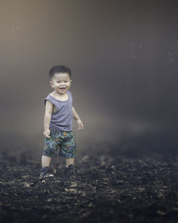 Full length of cute boy standing on land