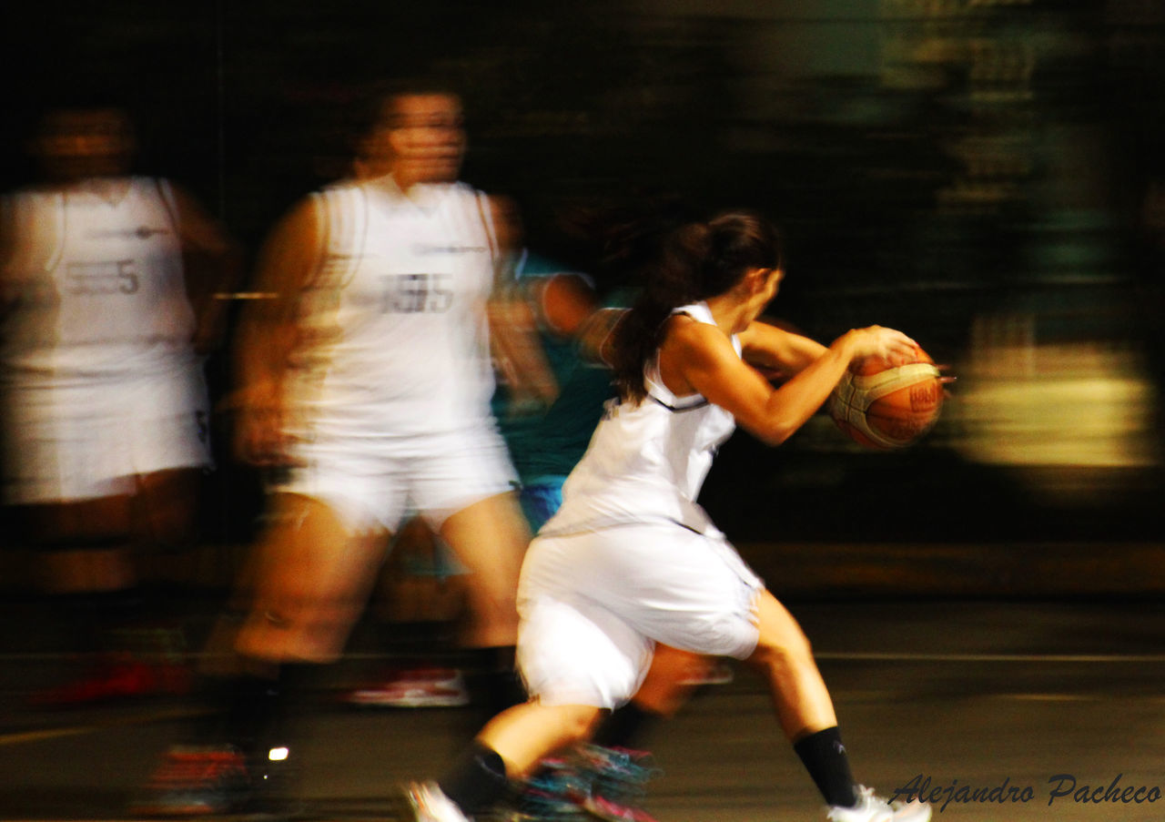 WOMAN JUMPING AT NIGHT